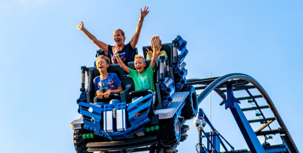 Children enjoying a rollercoaster