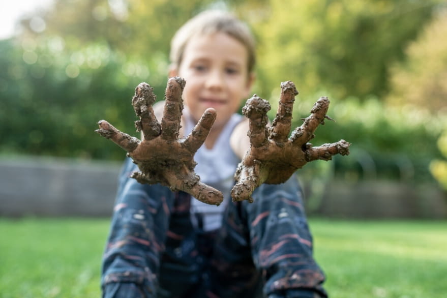 Child playing in mud